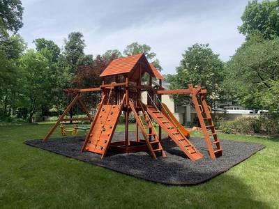 Wooden Woodplay playground with climbing and swings with monkeybars